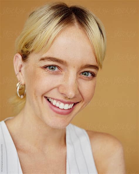 Natural Portrait Of A Happy Smiling Young Blonde Woman By Stocksy