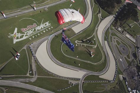 Top austria auto race tracks: Red Bull Sky Divers perform above the track during the ...