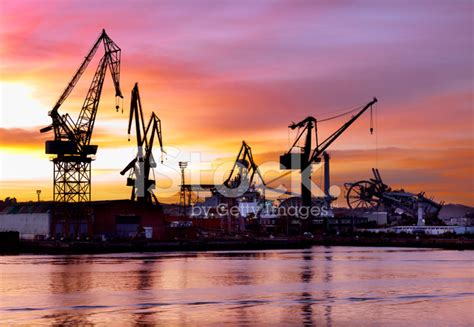 Dramatic Sunset Over A Shipyard Stock Photo Royalty Free Freeimages