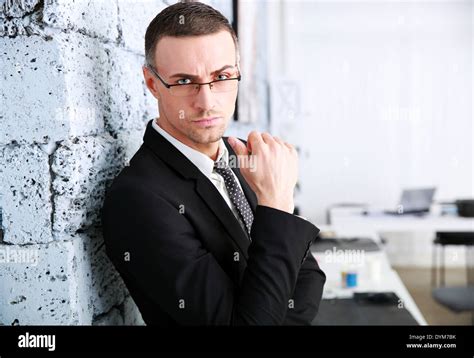 Confident Businessman Standing Near Brick Wall Stock Photo Alamy