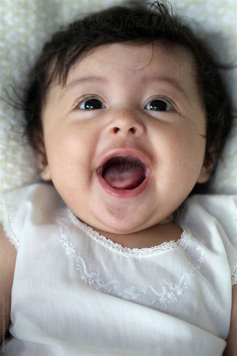 Dark Haired Hispanic Happy Baby By Stocksy Contributor Dina Marie