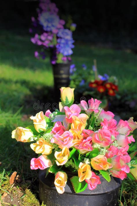 Maybe you would like to learn more about one of these? Graveside Flowers stock image. Image of monument, silk ...