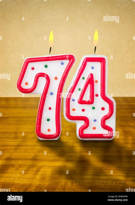 Burning Birthday Candles Number 74 Stock Photo Alamy