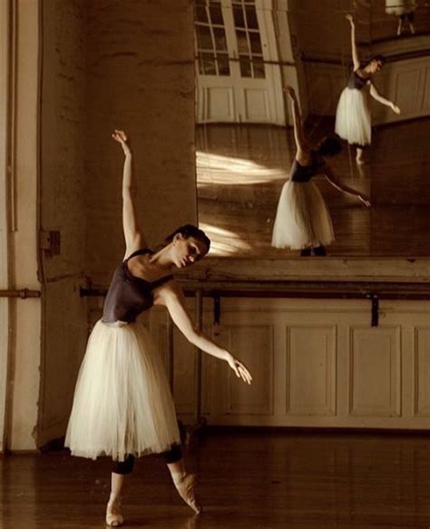 A Woman In A Tutu Is Doing Ballet