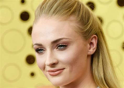 Sophie Turner Shows Off Growing Baby Bump In Body Hugging Jumpsuit With