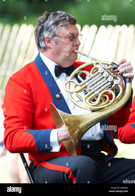 Man Playing The French Horn In A Traditional Brass Band At The Chelsea
