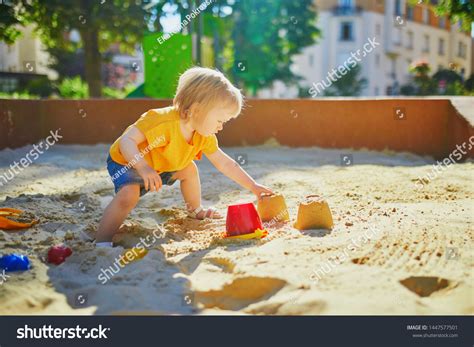Adorable Little Girl On Playground Sandpit Stock Photo 1447577501