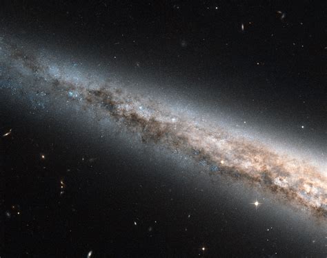 Hubble Sees The Needle Galaxy Edge On And Up Close