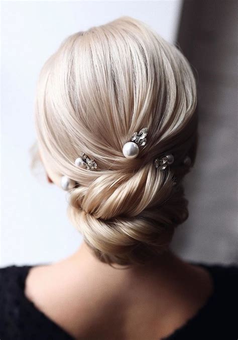 20 classic low bun wedding hairstyles from tonyastylist roses and rings