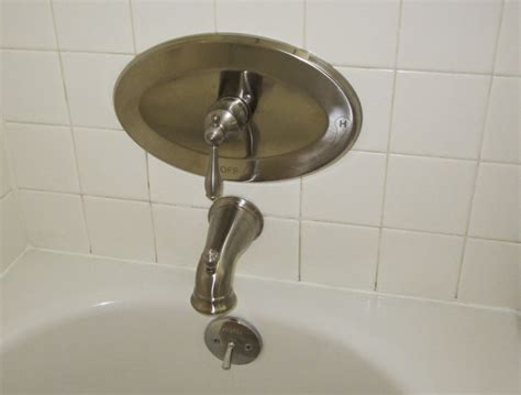 On top of control valve, pry off a plastic cover. GIY: Goth It Yourself: Bathroom Remodel: New Shower Faucet
