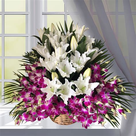Have you thought of buying a floral arrangement today? White Purple Flowers Basket Delivery in Dubai | Ajman ...