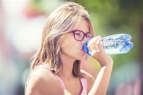 Young Girl Drinking Fresh Water On A Hot Summer Day Stock Photo Image