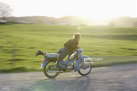 Germany Bavaria Mature Woman Riding Old Moped Of 1960s Photo Getty Images