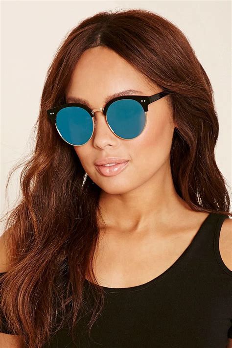 a pair of brow line sunglasses featuring vibrant mirrored lenses with 100 uv protection glossy
