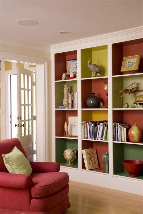 If painting the inside of your cabinets feels too tedious, try lining them with contact paper instead. colorful-built-in-shelves | Ikea living room, Home, Home decor