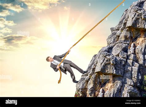 Businessman Climb A Mountain Stock Photo Alamy
