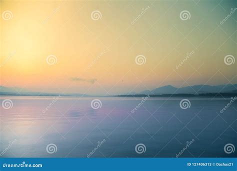 A Beautiful Calm Morning Landscape Of Lake And Mountains In The