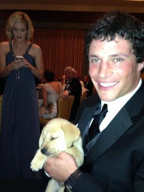 Luke With A Puppy Panthers Football Carolina Panthers Luke Kuechly
