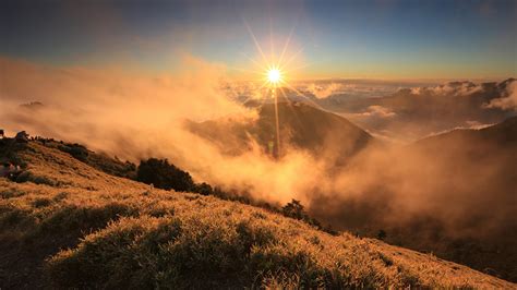 Pictures Fog Sun Nature Mountain Sunrises And Sunsets 1366x768