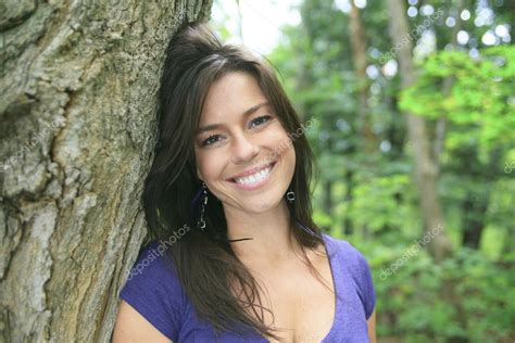 A Beautiful 30 Years Old Woman Standing In Forest Stock Photo By