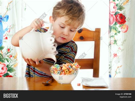 Boy Pouring Milk Into Image And Photo Free Trial Bigstock
