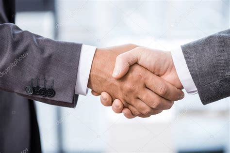 Businessmen shaking hands — Stock Photo © DmitryPoch ...