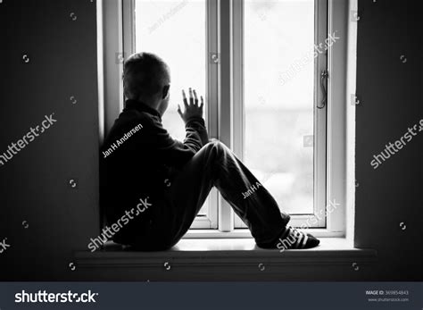 Lonely Boy Sitting On Windowsill While Stock Photo 369854843 Shutterstock