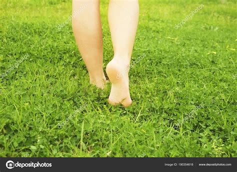 Female Bare Feet On Mawed Lawn Grass Young Woman Resting Outdoors Barefoot Take A Break