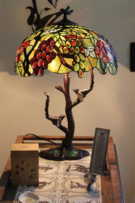 Tempt wild birds into your garden with white or red grapes, preparation is important by washing them before serving to birds, as well has throwing away rotten ones. Extravagant Tiffany-style Grapes / Birds Tree Mosaic Table ...