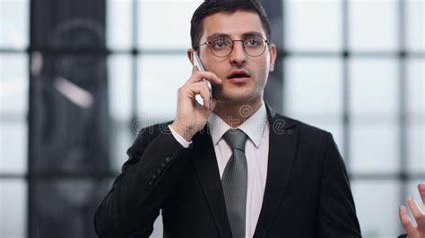 Confident Young Man In Full Suit Talking On The Mobile Phone Stock