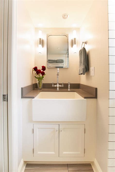 Includes weathered gray cabinet with authentic italian carrara marble countertop and white ceramic farmhouse apron sink. Small Bathroom's Retro Vanity Features Farmhouse Sink | HGTV