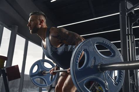 The Male Athlete Training Hard In The Gym Fitness And Healthy Life
