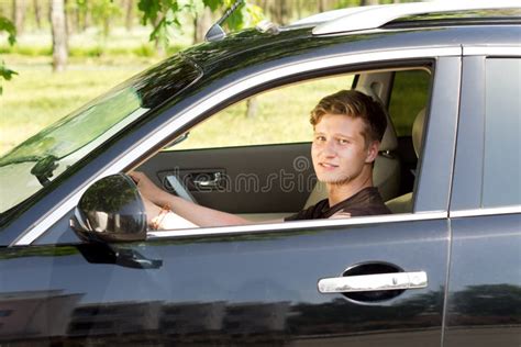 Smiling Young Man Driving A Car Stock Photos Image 30876523