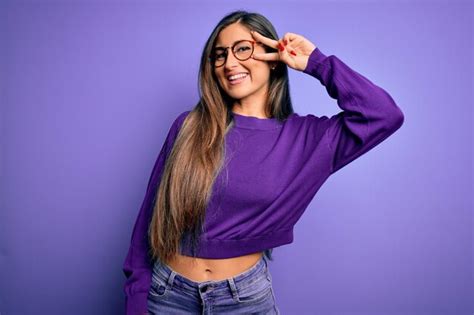 Premium Photo Young Beautiful Smart Woman Wearing Glasses Over Purple