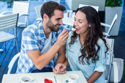 Young Happy Couple Feeding Each Other With Cake Stock Image Image Of
