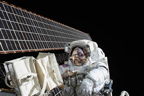 Photography Of Astronaut Beside Satellite Image Free Photo