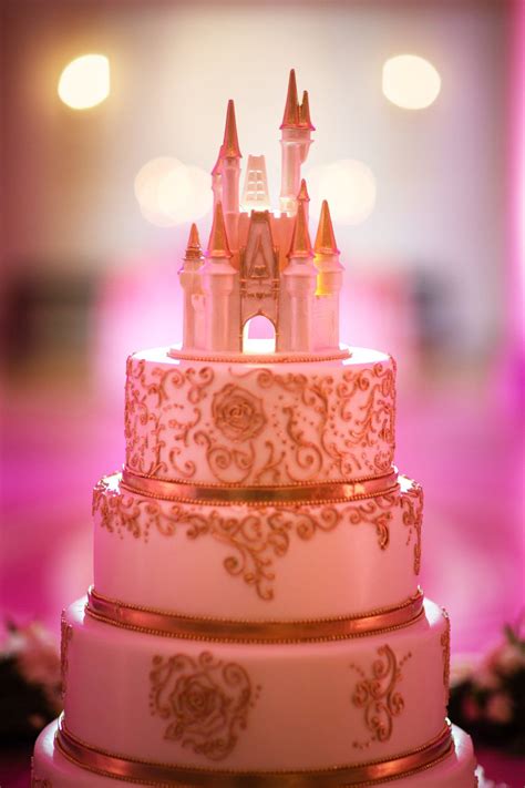 white and gold fairytale wedding castle cake at disney s american adventure rotunda in epcot