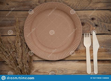 Ecological Disposable Tableware Paper Cardboard Empty On A Wooden Table