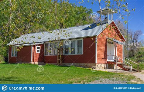 Old Red School House On A Hill With Wooden Steps Is In Shell Wyoming