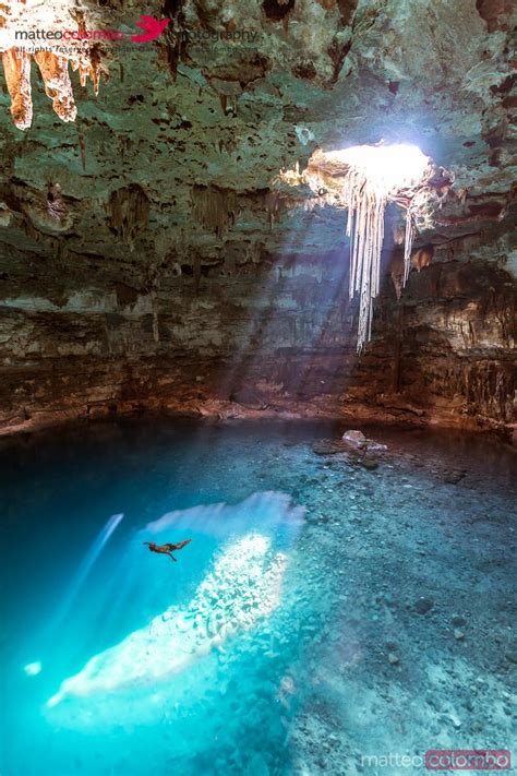Blue Cenote With Sunlight From The Top Yucatan Mexico Royalty