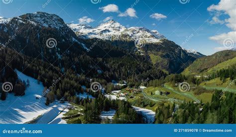 Idyllic Spring Landscape In The Alps With Fresh Green Meadows And