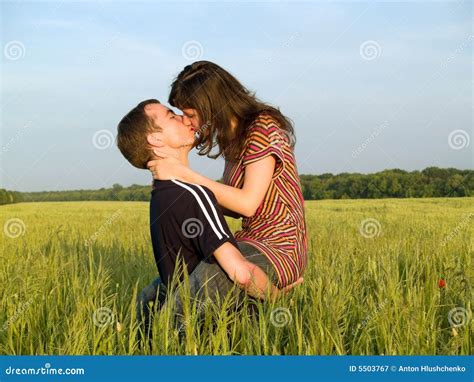 Teen Couple Kissing In Field Stock Image Image Of Countryside Casual