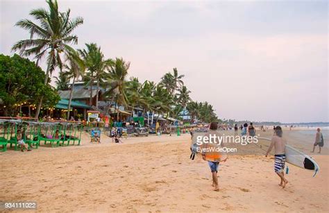 Local People And Tourists Visit Hikkaduwa Beach In The South Ouest