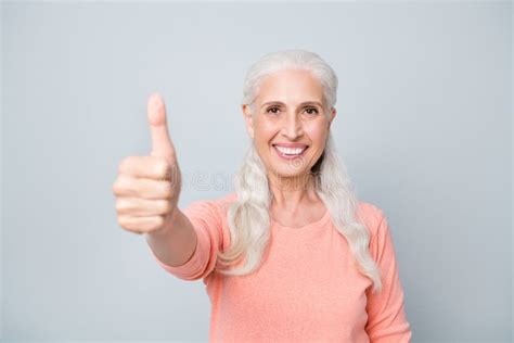 Close Up Photo Portrait Of Charming Lady Granny Making Finger Up Signal Wearing Peach Color