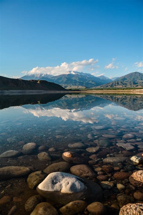 Maybe you would like to learn more about one of these? Landscape Photography of Body of Water Near Mountains ...