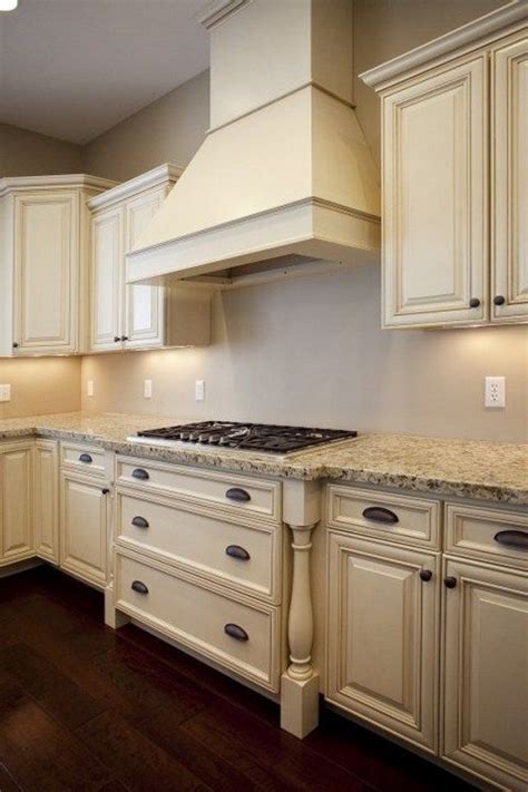 When you choose paint colors for your kitchen, you want to. French Country Kitchen Cream Cabinets With Wood Floor ...