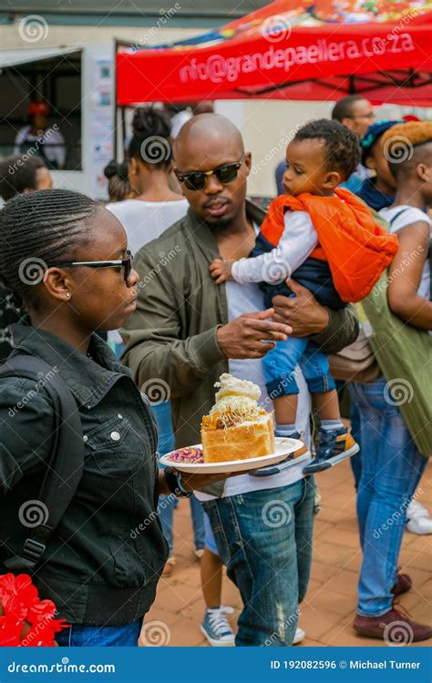 Diverse African Vendors Cooking And Serving Various Bread Based Street Food At Outdoor Festival