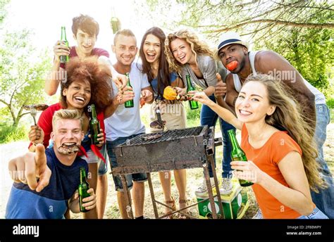 Happy Multiracial Friends Having Fun At Picnic Barbecue Garden Party Friendship Concept With