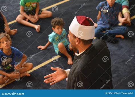 A Mosque Preacher Imam Performs A Religious Khutbah Sermon For Young