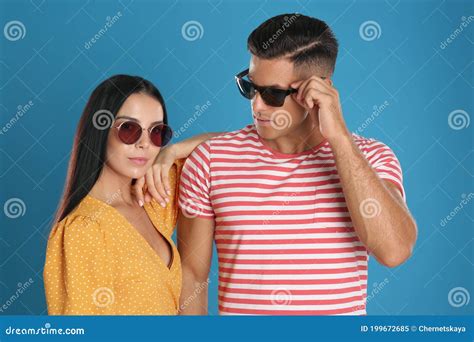 Stylish Couple Wearing Sunglasses On Blue Background Stock Image Image Of Adult Lady 199672685